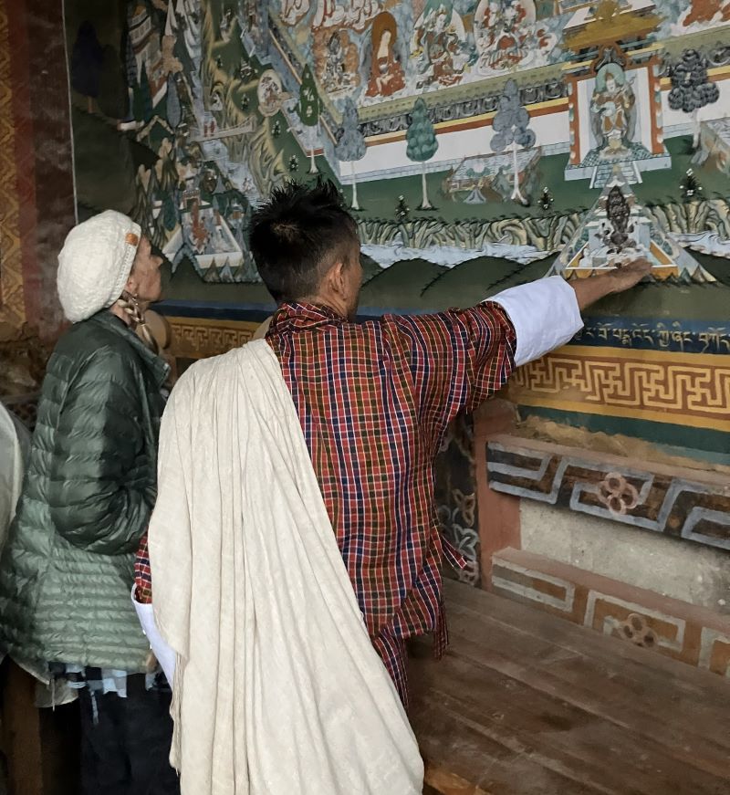 Extreme Nature Adventures Guide in Bhutan explains art to tourist